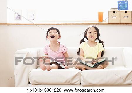 two girls reading a book View Large Photo Image Stock Photograph - two girls reading a book. Fotosearch