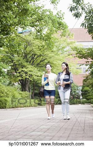university students walking in the campus talking View Large Photo Image Stock Photo - university students walking in the campus talking . Fotosearch