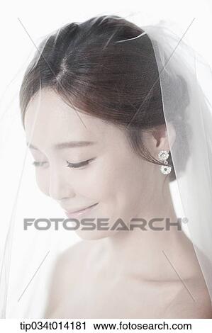 Stock Image - upper shot of a woman in wedding hair . Fotosearch