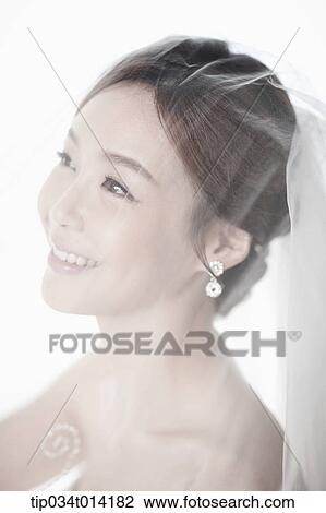 Stock Image - upper shot of a woman in wedding hair . Fotosearch