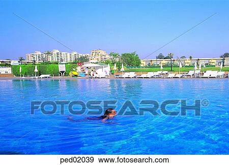 pool, swimming, suntanningchair, resort, hotelresort, hotel, parasol View Large Photo Image Stock Photo - pool, swimming, suntanningchair, resort, hotelresort, hotel, parasol. Fotosearch