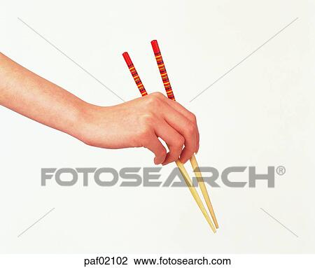 Stock Image - hand, finger, chopsticks, woman. Fotosearch