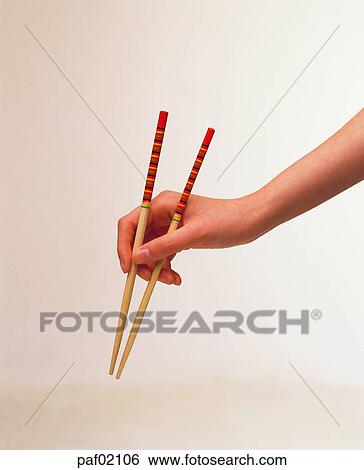 Stock Photograph - hand, finger, chopsticks, woman. Fotosearch