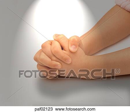 Stock Image - light, two hands, hands, hand, finger, pray. Fotosearch