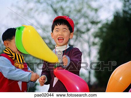 child, balloon, laughter, boy, outdoor, human, oriantal View Large Photo Image Picture - child, balloon, laughter, boy, outdoor, human, oriantal. Fotosearch