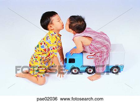 child, brother, kiss, indoor, toy, toy car, boy View Large Photo Image Stock Photograph - child, brother, kiss, indoor, toy, toy car, boy. Fotosearch