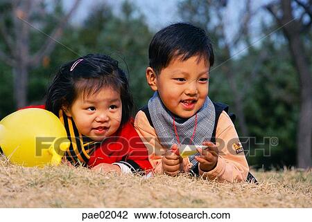 child, friend, smile, outdoor, human, oriantal, human View Large Photo Image Stock Image - child, friend, smile, outdoor, human, oriantal, human. Fotosearch