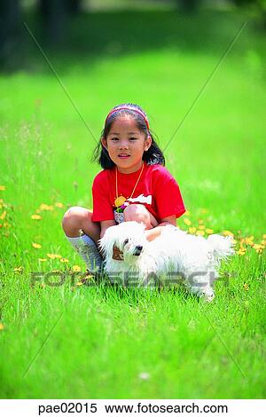Stock Photography - child, girl, puppy, animal, Oriental people. Fotosearch