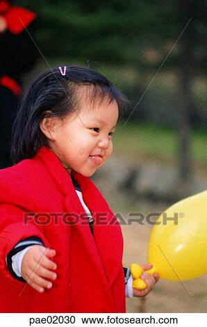 child, girlsmile, outdoor, oriantal View Large Photo Image Stock Image - child, girlsmile, outdoor, oriantal. Fotosearch