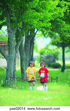 child, Oriental people, puppy, tree, friend, sister, girl View Large Photo Image Picture - child, Oriental people, puppy, tree, friend, sister, girl. Fotosearch