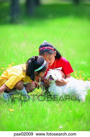 Stock Photo - child, puppy, girl, sister, animal, people. Fotosearch