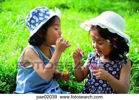 Stock Photo - child, soapbell, girl, outdoor, human, outdoor, oriantal. Fotosearch