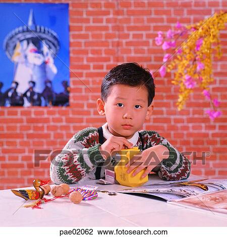 saving, child, boy, human, indoor, oriantal View Large Photo Image Stock Image - saving, child, boy, human, indoor, oriantal. Fotosearch