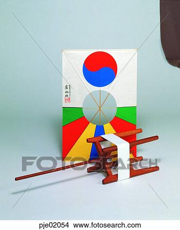 Picture - folk customs, shield-shaped kite, reel, kite, folk customs, game, play. Fotosearch