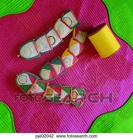Stock Image - folk tool, needle, sewing, spool, thread, a lady's bedroom. Fotosearch