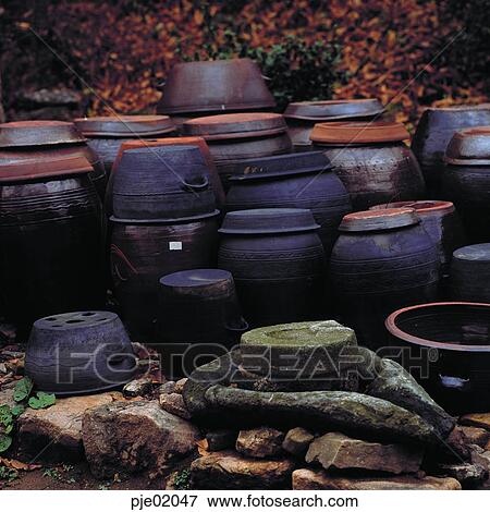millstone, earthenware steamer, jar, jar, folk tool, living articles, Korean culture View Large Photo Image Stock Photo - millstone, earthenware steamer, jar, jar, folk tool, living articles, Korean culture. Fotosearch