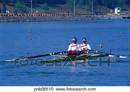 Stock Image - day, scull, paddle, Oriental, person, people. Fotosearch