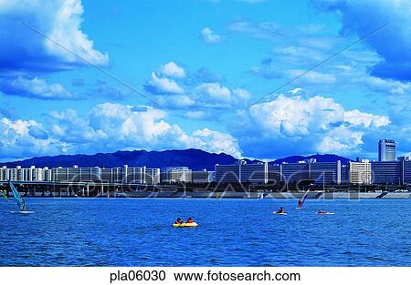 Stock Image - building, structure, rubber boat, cloud, men, male. Fotosearch