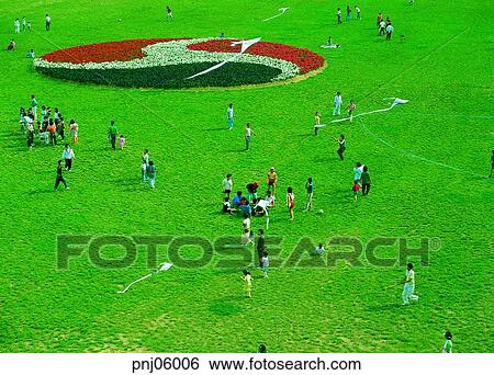 Stock Photograph - family, terrace land on the river, park, flower, family picnic, man and woman, men and women. Fotosearch