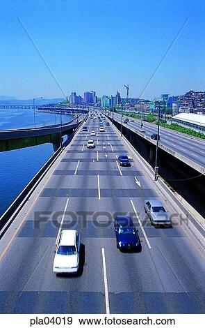 Stock Photo - riverside road, riverside road, traffic, transport, transit, traffic and street, traffic and road. Fotosearch