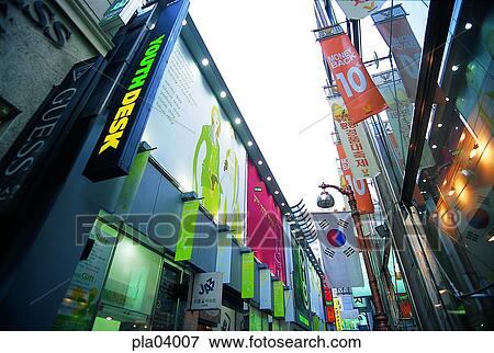 Stock Photo - shop, store, signboard, billboard, street, road, flag. Fotosearch