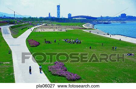 Stock Photo - terrace land on the river, park, road, street, way, family picnic, man and woman. Fotosearch