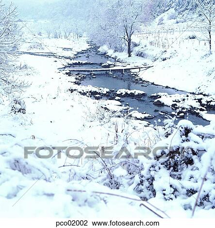 Stock Image - brook, little stream, bridge, winter, winter tree, winter scenery, winter scene. Fotosearch
