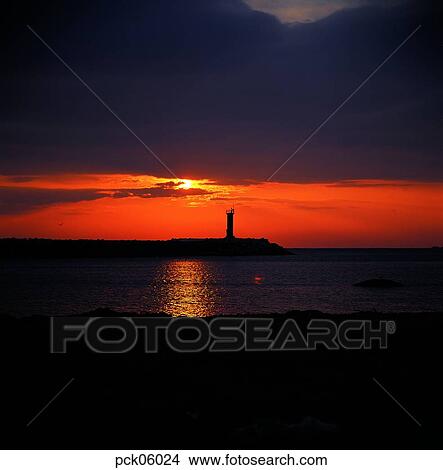 cloud, red sky, sunset, sunrise, lighthouse, beacon, wave View Large Photo Image Picture - cloud, red sky, sunset, sunrise, lighthouse, beacon, wave. Fotosearch