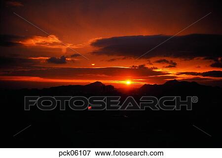 cloud, red sky, sunset, sunrise, ridgeline, outline, towering mass of clouds View Large Photo Image Stock Photo - cloud, red sky, sunset, sunrise, ridgeline, outline, towering mass of clouds. Fotosearch