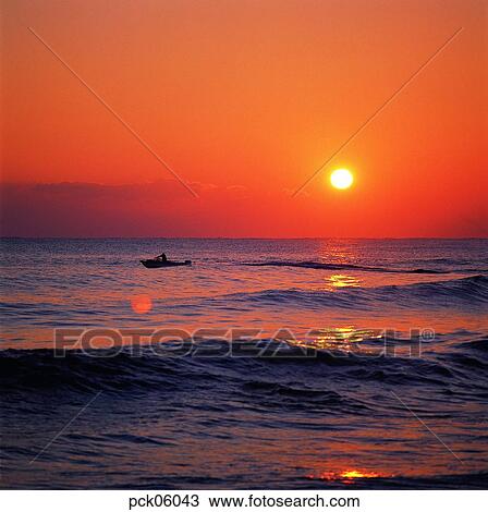 Stock Image - cloud, return trip, return voyage, red sky, sunset, sunrise, wave. Fotosearch