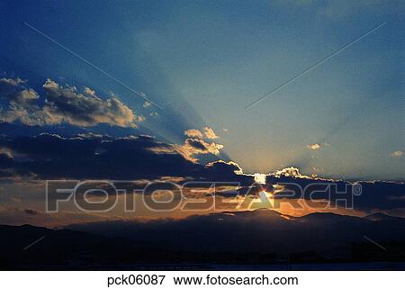Stock Photo - light, ray, beam, cloud, red sky, sunset, sunrise. Fotosearch