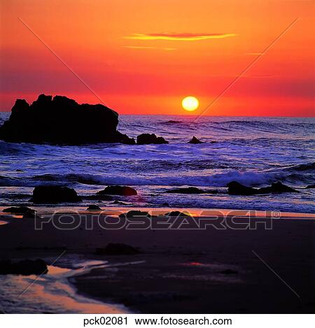 red sky, sunset, sunrise, stone, rock, sandy beach, sands View Large Photo Image Stock Image - red sky, sunset, sunrise, stone, rock, sandy beach, sands. Fotosearch