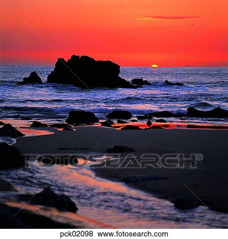 red sky, sunset, sunrise, stone, rock, sandy beach, sands View Large Photo Image Stock Photo - red sky, sunset, sunrise, stone, rock, sandy beach, sands. Fotosearch