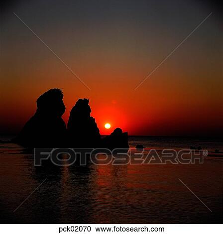 Stock Image - red sky, sunset, sunrise, wave, surge, ripple, sea. Fotosearch