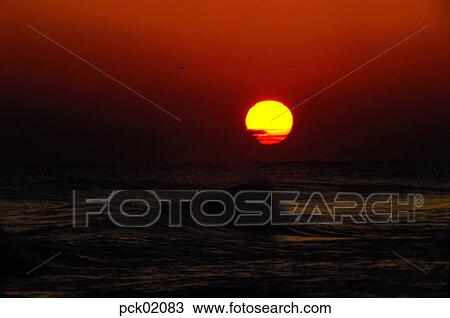 red sky, sunset, sunrise, wave, surge, ripple, sea View Large Photo Image Stock Image - red sky, sunset, sunrise, wave, surge, ripple, sea. Fotosearch