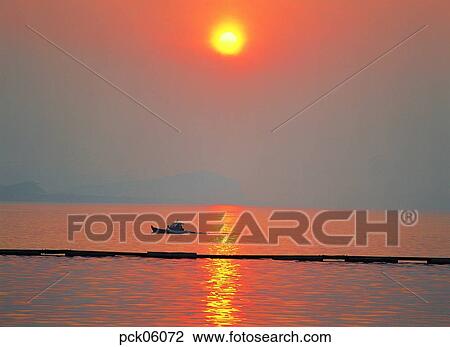 red sky, sunset, sunrise, wave, surge, ripple, shadows on the water View Large Photo Image Stock Image - red sky, sunset, sunrise, wave, surge, ripple, shadows on the water. Fotosearch