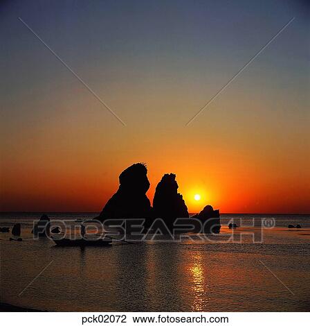 Stock Image - return trip, return voyage, boy, men, male, red sky. Fotosearch
