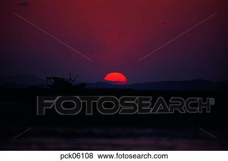 riverside village, red sky, sunset, sunrise, ship, boat View Large Photo Image Stock Photo - riverside village, red sky, sunset, sunrise, ship, boat. Fotosearch