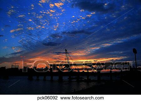 Stock Image - bridge, pier, bridge, cloud, fabric, structure, red sky. Fotosearch