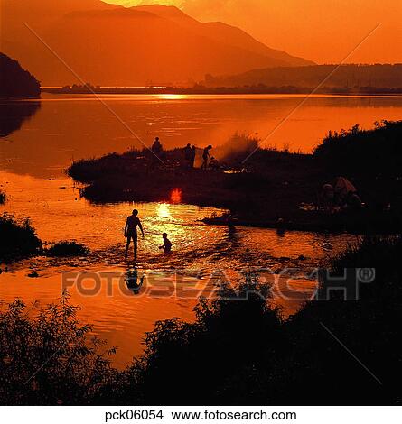 family, family picnic, river, riverside, picnic, fishing, man and woman View Large Photo Image Picture - family, family picnic, river, riverside, picnic, fishing, man and woman. Fotosearch