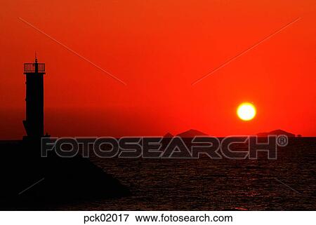 red sky, sunset, sunrise, lighthouse, beacon, wave, surge View Large Photo Image Stock Photo - red sky, sunset, sunrise, lighthouse, beacon, wave, surge. Fotosearch