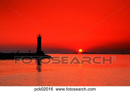 red sky, sunset, sunrise, two people, lighthouse, beacon, wave View Large Photo Image Stock Photograph - red sky, sunset, sunrise, two people, lighthouse, beacon, wave. Fotosearch
