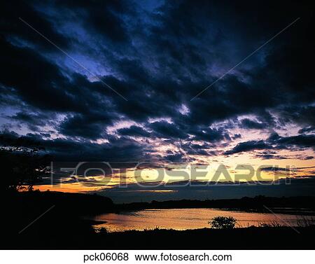 river, riverside, cloud, climate, weather, red sky, sunset View Large Photo Image Stock Photo - river, riverside, cloud, climate, weather, red sky, sunset. Fotosearch