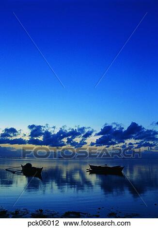 Stock Image - river, riverside, cloud, ferry, ferryboat, red sky, sunset. Fotosearch