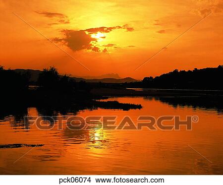 river, riverside, riverside village, cloud, red sky, sunset, sunrise View Large Photo Image Picture - river, riverside, riverside village, cloud, red sky, sunset, sunrise. Fotosearch