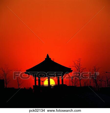 street light, street lamp, street tree, avenue, red sky, sunset, sunrise View Large Photo Image Picture - street light, street lamp, street tree, avenue, red sky, sunset, sunrise. Fotosearch