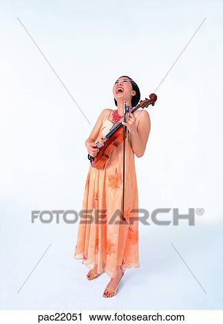 Stock Image - Oriental, dress, model, violin, person, people. Fotosearch