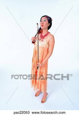 Stock Image - Oriental, dress, model, violin, person, people. Fotosearch