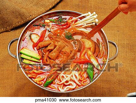 Stock Image - chitterlings hot stew, hand, hands, men, person, people. Fotosearch