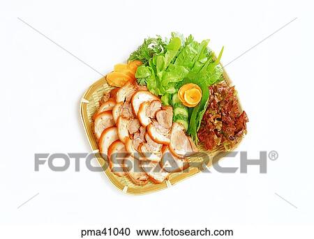 Stock Image - pork hock, indoor, rice wrapped in leaves, cook, cooking, food. Fotosearch
